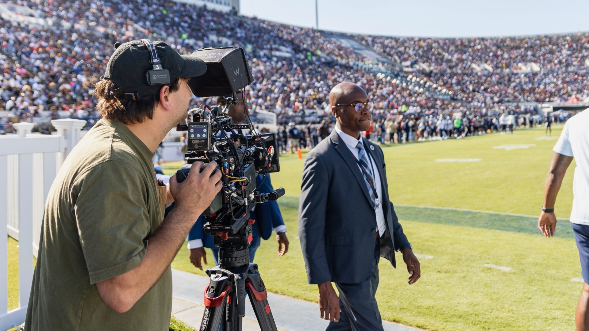 Camera operator with a subject on location